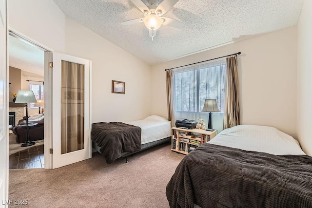 605 Devonhall St Unit 201, Las Vegas, NV 89145 - carpeted bedroom with a textured ceiling, vaulted ceiling, and a ceiling fan