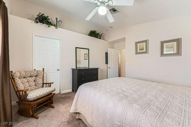 605 Devonhall St Unit 201, Las Vegas, NV 89145 - carpeted bedroom featuring vaulted ceiling, ceiling fan, and a textured ceiling