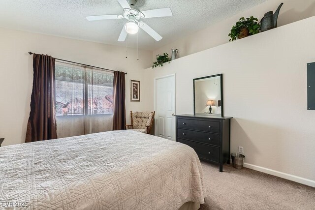 605 Devonhall St Unit 201, Las Vegas, NV 89145 - bedroom with light carpet, a textured ceiling, baseboards, ceiling fan, and electric panel