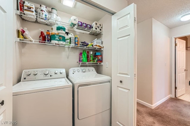 605 Devonhall St Unit 201, Las Vegas, NV 89145 - laundry area with washer and clothes dryer, carpet, baseboards, and a textured ceiling