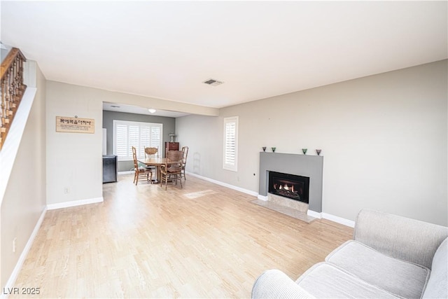 9021 Feather River Ct, Las Vegas, NV 89117 - living room with light wood finished floors and a fireplace with flush hearth