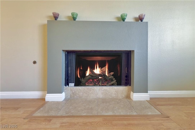 9021 Feather River Ct, Las Vegas, NV 89117 - detailed view of a fireplace with flush hearth and wood finished floors