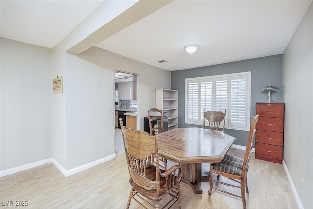 9021 Feather River Ct, Las Vegas, NV 89117 - dining room with light wood-type flooring and baseboards