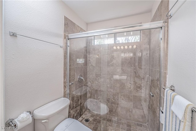 9021 Feather River Ct, Las Vegas, NV 89117 - bathroom with a stall shower and a textured wall