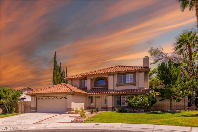 9021 Feather River Ct, Las Vegas, NV 89117 - mediterranean / spanish-style house featuring stucco siding, an attached garage, concrete driveway, a tiled roof, and a front lawn