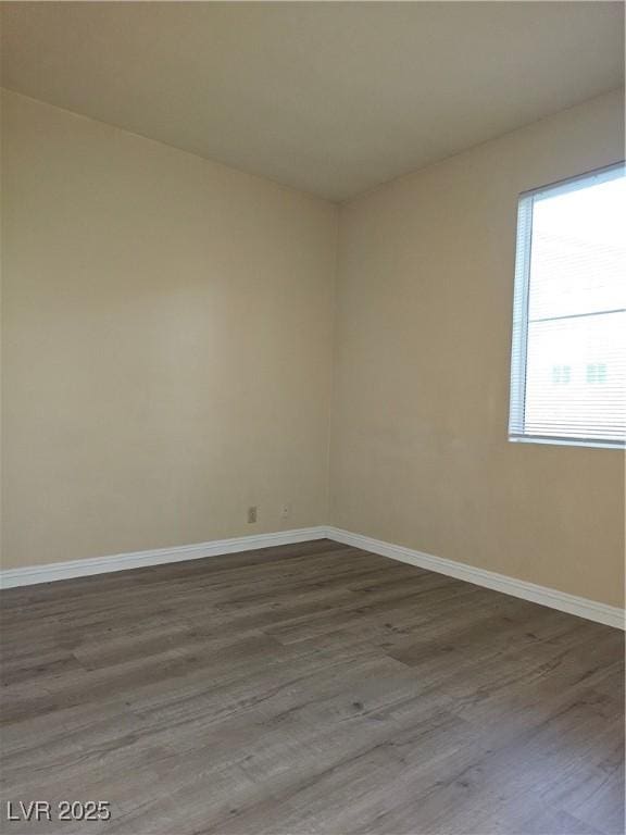 5155 W Tropicana Ave Unit 2140, Las Vegas, NV 89103 - empty room with dark wood finished floors and baseboards