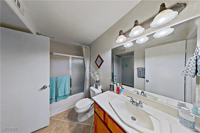 698 S Racetrack Rd Unit 1714, Henderson, NV 89015 - bathroom featuring vanity, enclosed tub / shower combo, toilet, and tile patterned flooring