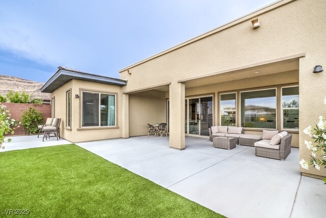 6728 Regency Ridge Ct, Las Vegas, NV 89148 - rear view of property with a patio area, stucco siding, and an outdoor hangout area