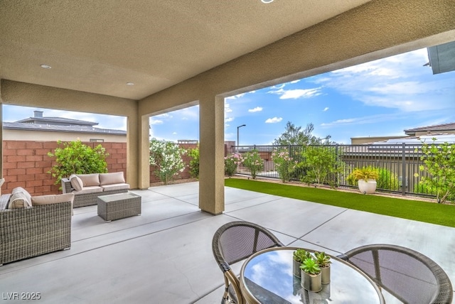 6728 Regency Ridge Ct, Las Vegas, NV 89148 - fenced backyard featuring a patio area and an outdoor living space