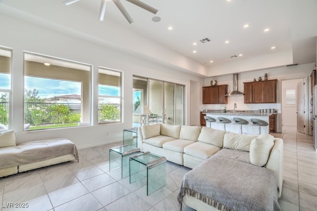 6728 Regency Ridge Ct, Las Vegas, NV 89148 - living room with a ceiling fan, light tile patterned floors, and recessed lighting