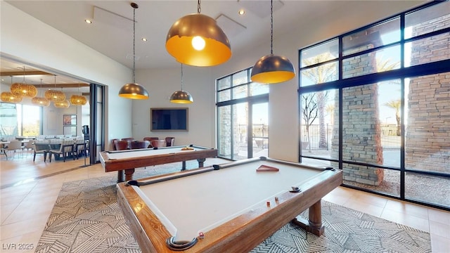 6728 Regency Ridge Ct, Las Vegas, NV 89148 - game room with a towering ceiling, tile patterned floors, healthy amount of natural light, billiards table, and recessed lighting