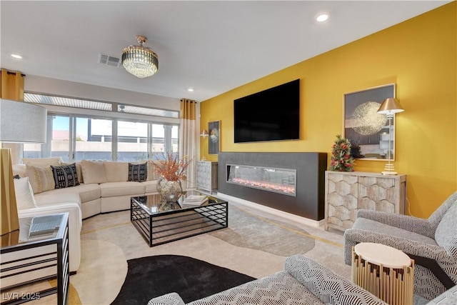 7208 Grace Estate Ave, Las Vegas, NV 89113 - living room with a glass covered fireplace and recessed lighting