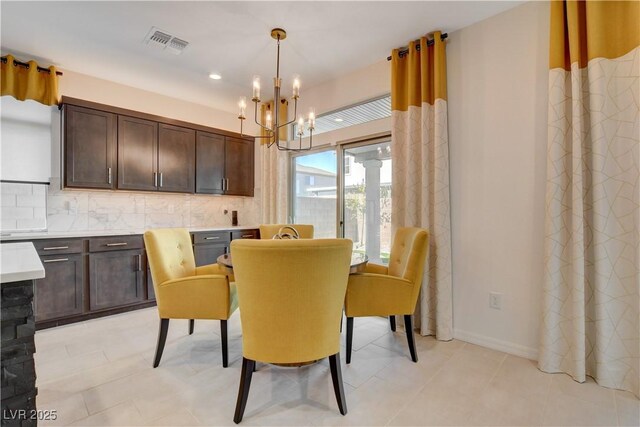 7208 Grace Estate Ave, Las Vegas, NV 89113 - dining space with a chandelier