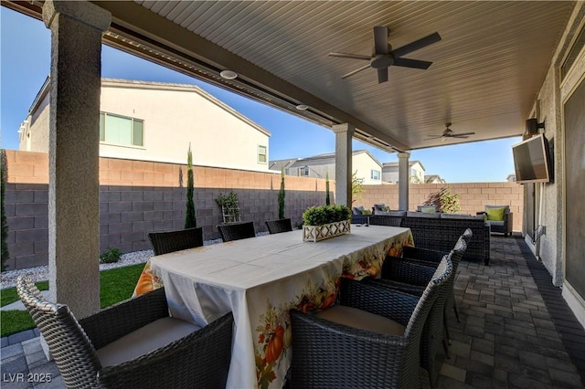 7208 Grace Estate Ave, Las Vegas, NV 89113 - fenced backyard featuring a patio, outdoor lounge area, ceiling fan, and outdoor dining area