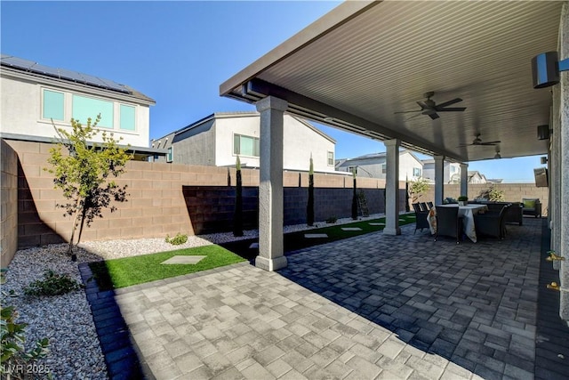 7208 Grace Estate Ave, Las Vegas, NV 89113 - fenced backyard featuring a ceiling fan, a patio area, and outdoor dining area