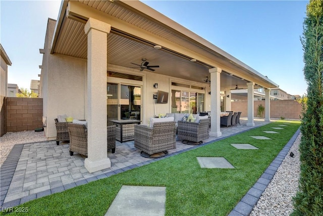 7208 Grace Estate Ave, Las Vegas, NV 89113 - rear view of house featuring outdoor lounge area, ceiling fan, stucco siding, and a patio area