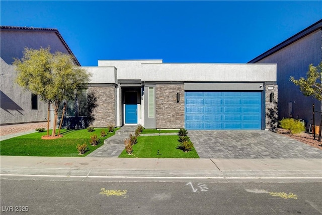 7208 Grace Estate Ave, Las Vegas, NV 89113 - view of front facade with an attached garage, a front yard, stucco siding, and driveway