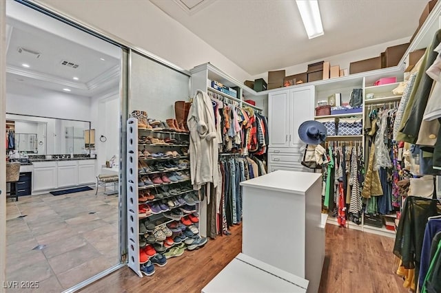 7408 Via Fiorentino St, Las Vegas, NV 89131 - walk in closet with light wood-style floors