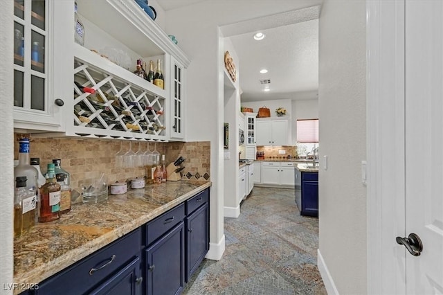 7408 Via Fiorentino St, Las Vegas, NV 89131 - indoor bar featuring tasteful backsplash, light stone finish flooring, and recessed lighting