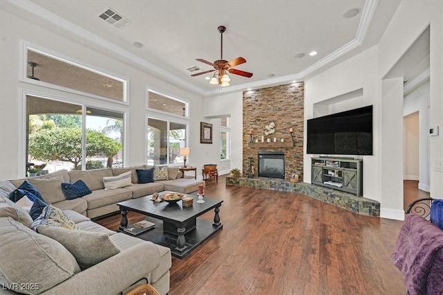 7408 Via Fiorentino St, Las Vegas, NV 89131 - living room with crown molding, ceiling fan, wood finished floors, a fireplace, and recessed lighting