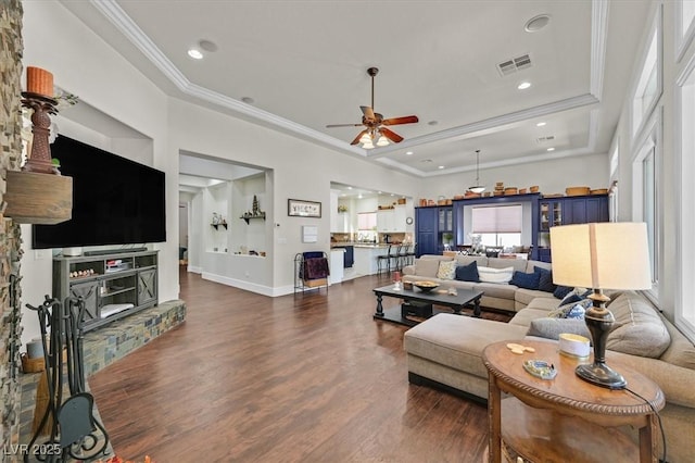 7408 Via Fiorentino St, Las Vegas, NV 89131 - living area featuring a ceiling fan, wood finished floors, ornamental molding, a tray ceiling, and recessed lighting
