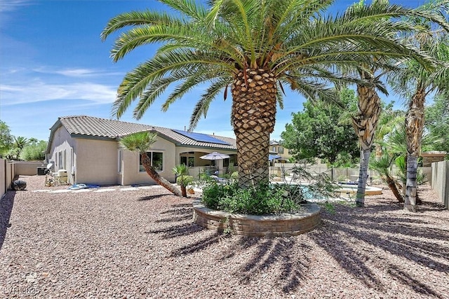 7408 Via Fiorentino St, Las Vegas, NV 89131 - back of house featuring stucco siding, a fenced backyard, a patio area, and a tile roof