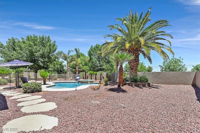7408 Via Fiorentino St, Las Vegas, NV 89131 - view of swimming pool with a fenced backyard, a pool with connected hot tub, and a patio area