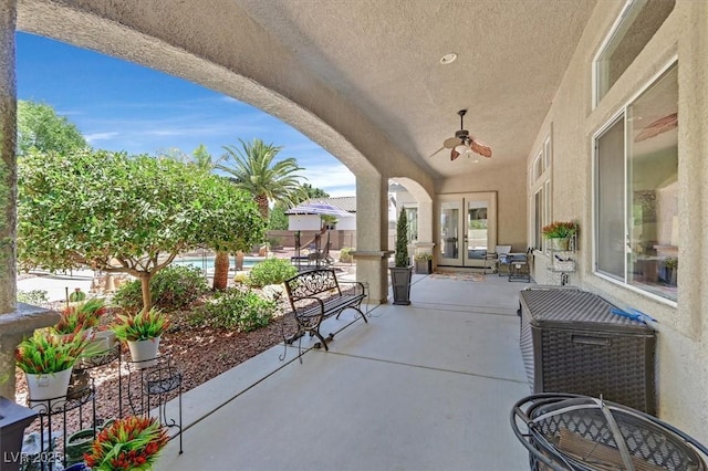 7408 Via Fiorentino St, Las Vegas, NV 89131 - view of patio featuring a ceiling fan, french doors, and an outdoor pool