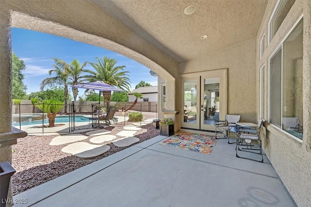 7408 Via Fiorentino St, Las Vegas, NV 89131 - fenced backyard featuring french doors and a patio