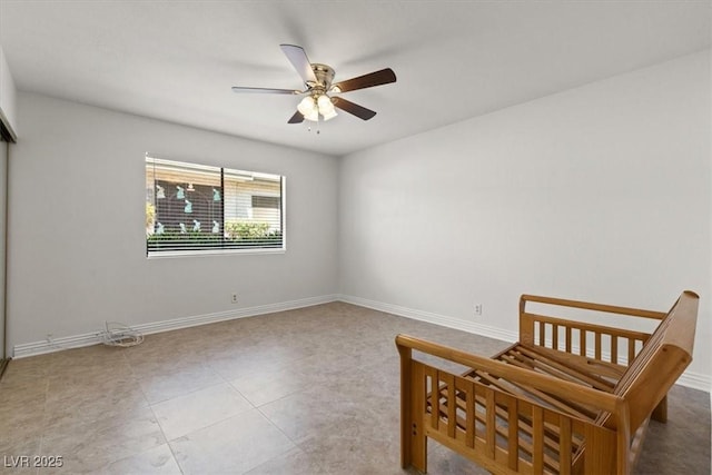 2480 Domingo St, Las Vegas, NV 89121 - tiled bedroom with baseboards and a ceiling fan