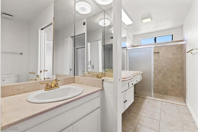 2480 Domingo St, Las Vegas, NV 89121 - full bathroom with vanity, a shower stall, tile patterned floors, and toilet