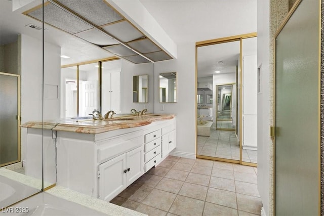 2480 Domingo St, Las Vegas, NV 89121 - full bathroom featuring double vanity, tile patterned flooring, and baseboards