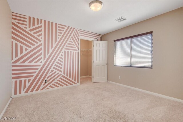 6402 Parrot Ridge Ct, Las Vegas, NV 89139 - unfurnished bedroom with carpet flooring, baseboards, a walk in closet, and a closet