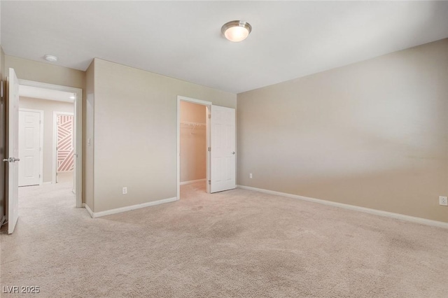 6402 Parrot Ridge Ct, Las Vegas, NV 89139 - unfurnished bedroom with light carpet, a spacious closet, and baseboards