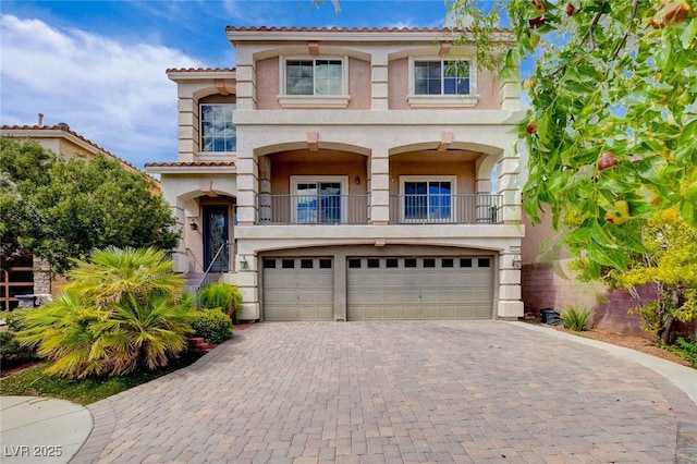 6402 Parrot Ridge Ct, Las Vegas, NV 89139 - view of front of house with a garage, decorative driveway, stucco siding, and a balcony