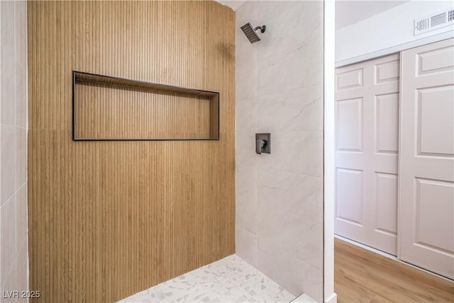 1600 E Mcdonald Ave, North Las Vegas, NV 89030 - full bath with tiled shower and wood finished floors