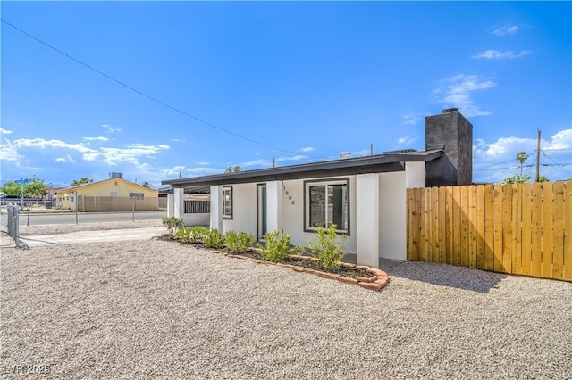 1600 E Mcdonald Ave, North Las Vegas, NV 89030 - view of front of home with a chimney and stucco siding