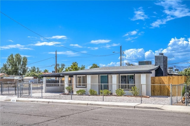 1600 E Mcdonald Ave, North Las Vegas, NV 89030 - ranch-style house featuring covered porch, a fenced front yard, stucco siding, and a gate