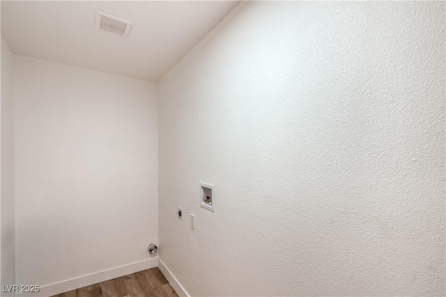 1600 E Mcdonald Ave, North Las Vegas, NV 89030 - washroom featuring washer hookup, electric dryer hookup, light wood finished floors, and baseboards