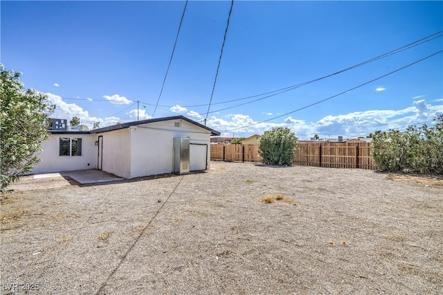 1600 E Mcdonald Ave, North Las Vegas, NV 89030 - rear view of property featuring stucco siding