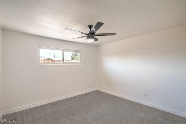 1600 E Mcdonald Ave, North Las Vegas, NV 89030 - carpeted spare room featuring baseboards and ceiling fan