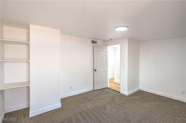 1600 E Mcdonald Ave, North Las Vegas, NV 89030 - unfurnished bedroom featuring carpet and baseboards