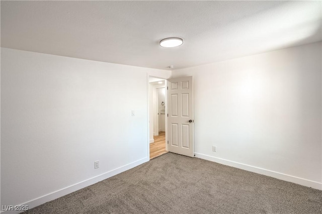 1600 E Mcdonald Ave, North Las Vegas, NV 89030 - empty room with carpet floors and baseboards