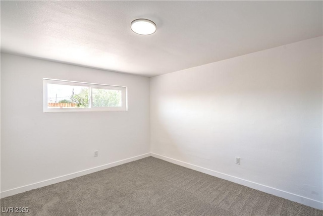1600 E Mcdonald Ave, North Las Vegas, NV 89030 - unfurnished room with dark colored carpet and baseboards