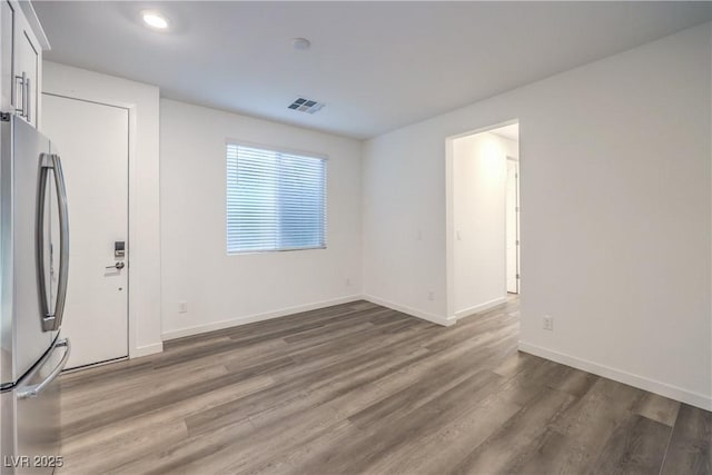 12404 Aster Hills Ave, Las Vegas, NV 89138 - empty room with wood finished floors and recessed lighting