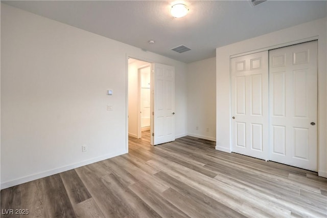 12404 Aster Hills Ave, Las Vegas, NV 89138 - unfurnished bedroom featuring wood finished floors and a closet