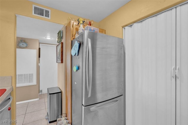 7950 W Flamingo Rd Unit 1003, Las Vegas, NV 89147 - kitchen featuring stainless steel appliances and light tile patterned floors