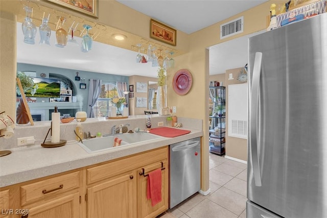 7950 W Flamingo Rd Unit 1003, Las Vegas, NV 89147 - kitchen with appliances with stainless steel finishes, light countertops, and light tile patterned floors