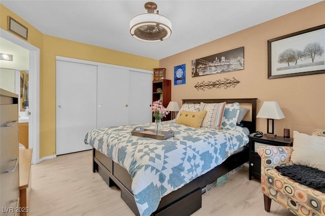 7950 W Flamingo Rd Unit 1003, Las Vegas, NV 89147 - bedroom featuring a closet and light wood finished floors