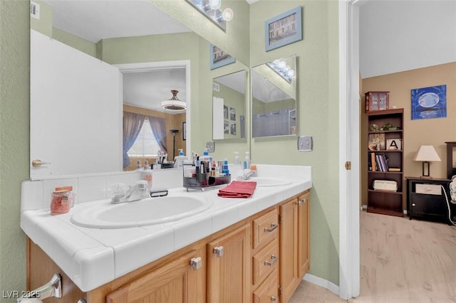 7950 W Flamingo Rd Unit 1003, Las Vegas, NV 89147 - full bathroom featuring double vanity and baseboards